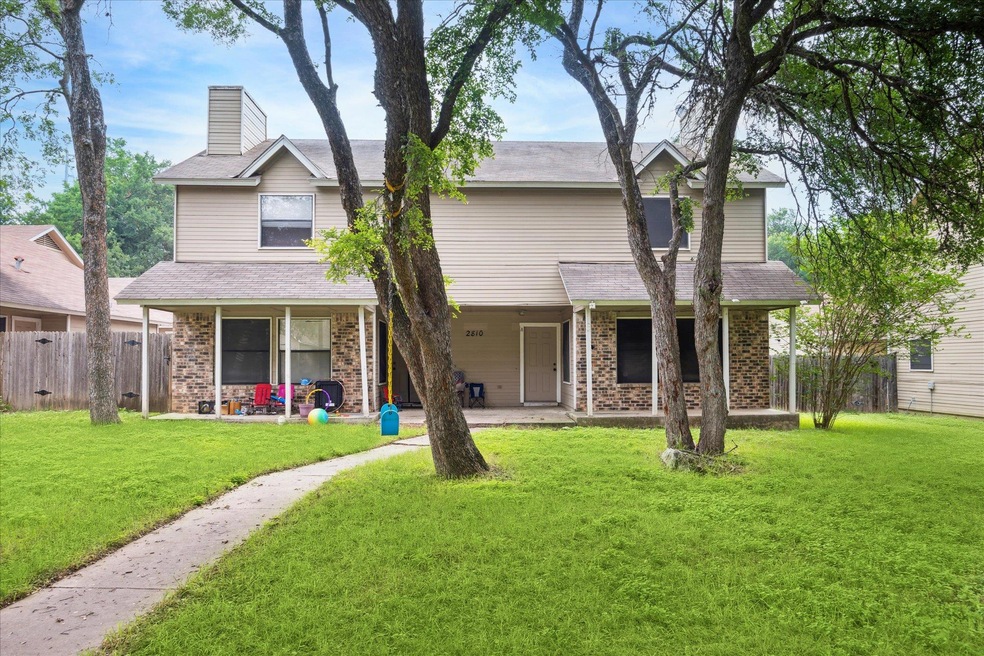 View of front facade featuring brick siding and a