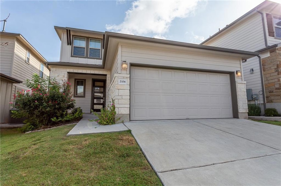 View of front of home with stone siding, concrete