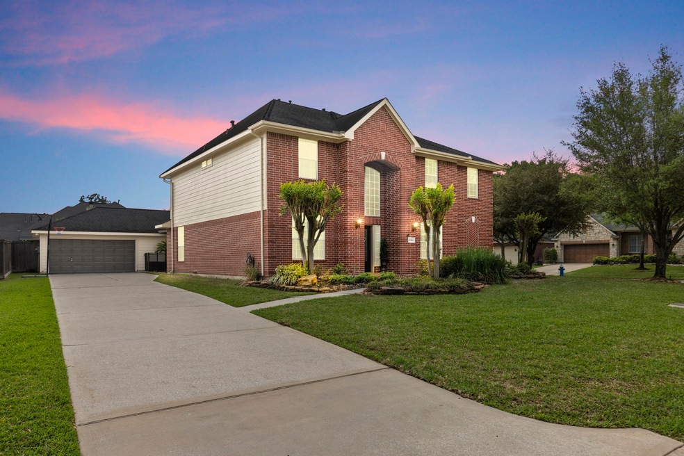 Charming two-story brick home with a spacious driv