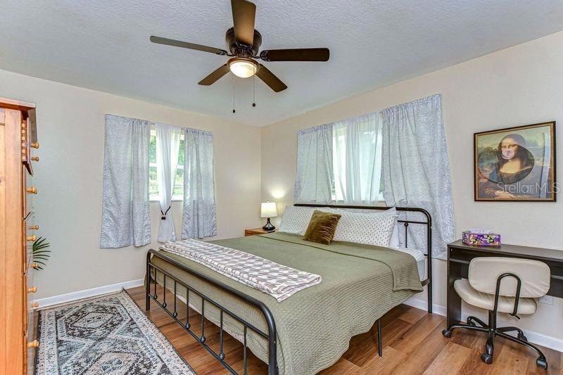 The master bedroom features a comfortable king bed and large closet