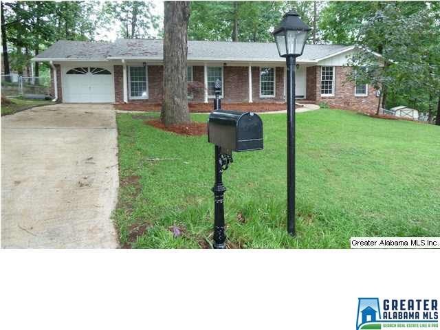 Full brick one level with a garage, screened porch