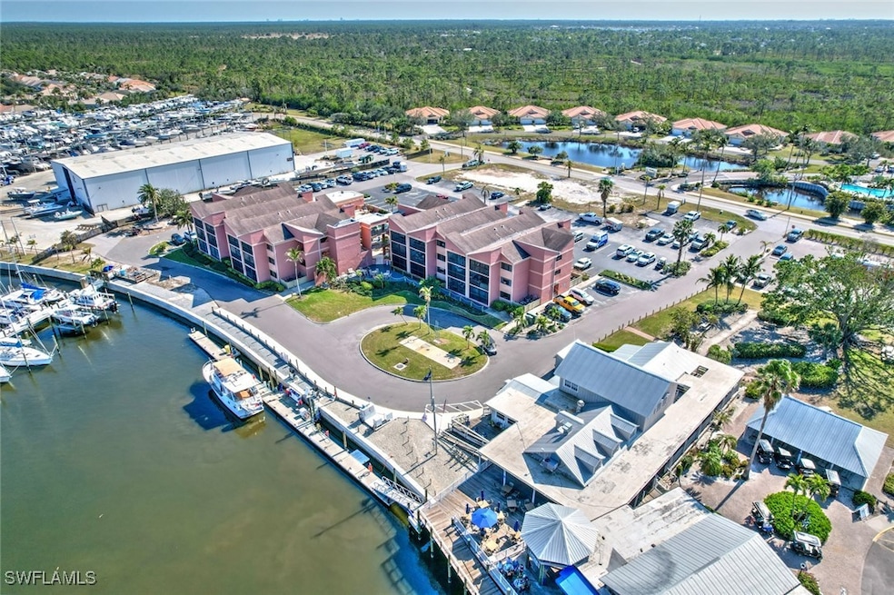 Bird's eye view featuring a water view and a fores