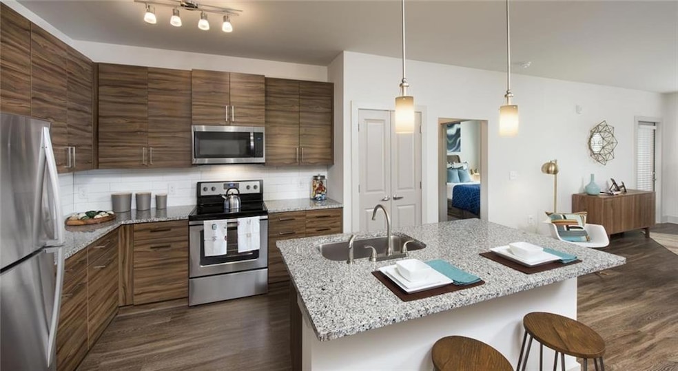 Kitchen with sink, dark hardwood / wood-style floo