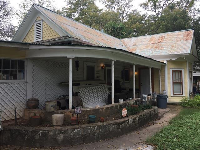Gorgeous stone work! Awesome front porch! Tin Roof