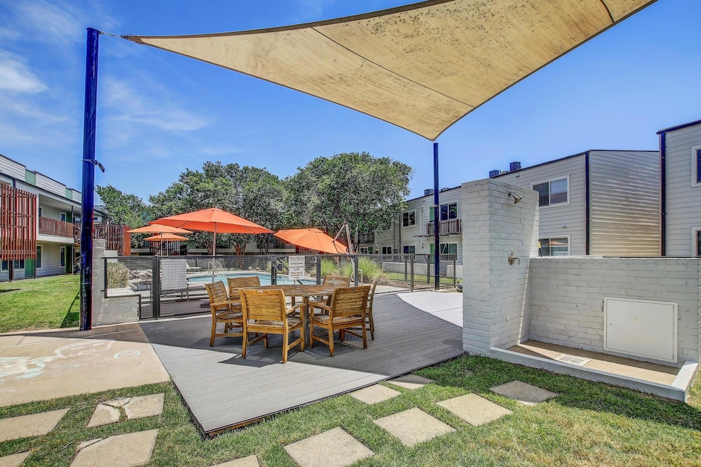 View of patio / terrace featuring fence and a deck