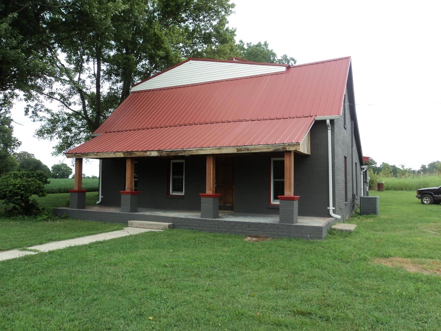 Renovated Farm House, with a rocking chair front porch