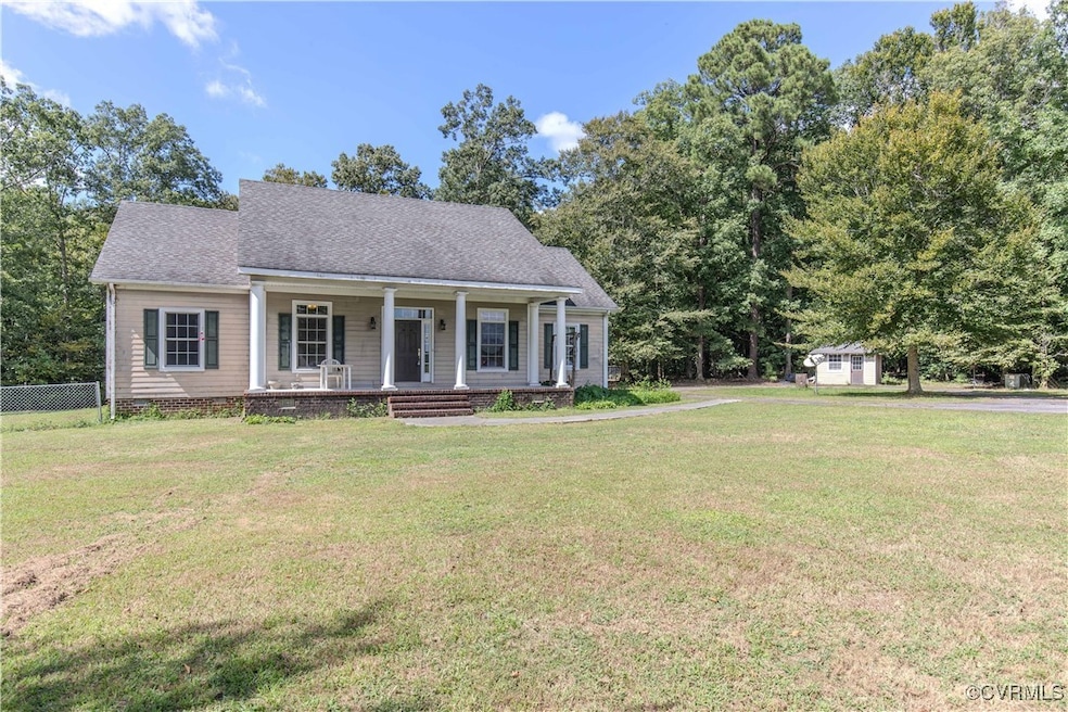View of front of house with a porch and a front la