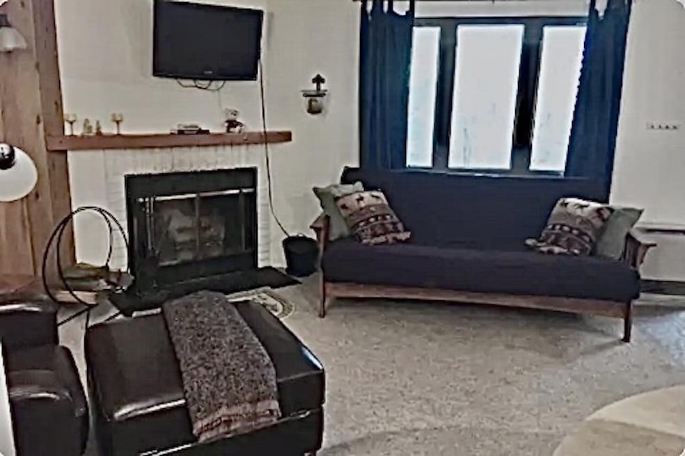 White brick wood burning fireplace.