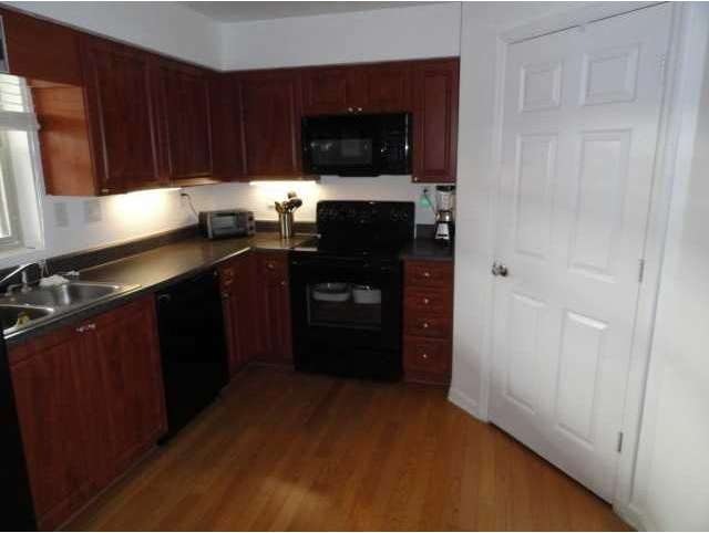 Exterior Front. Beautiful Kitchen with Black Appli