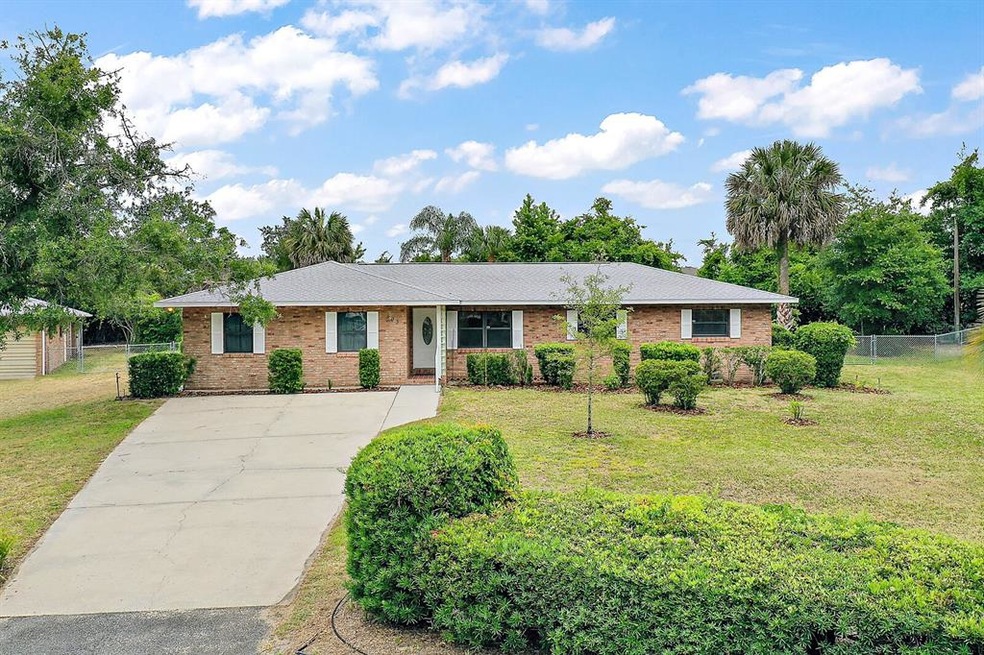 Stucco brick home on .87 acre lot with 2-car attac