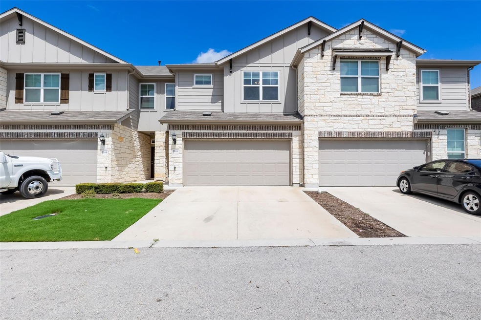 Townhome / multi-family property featuring board 