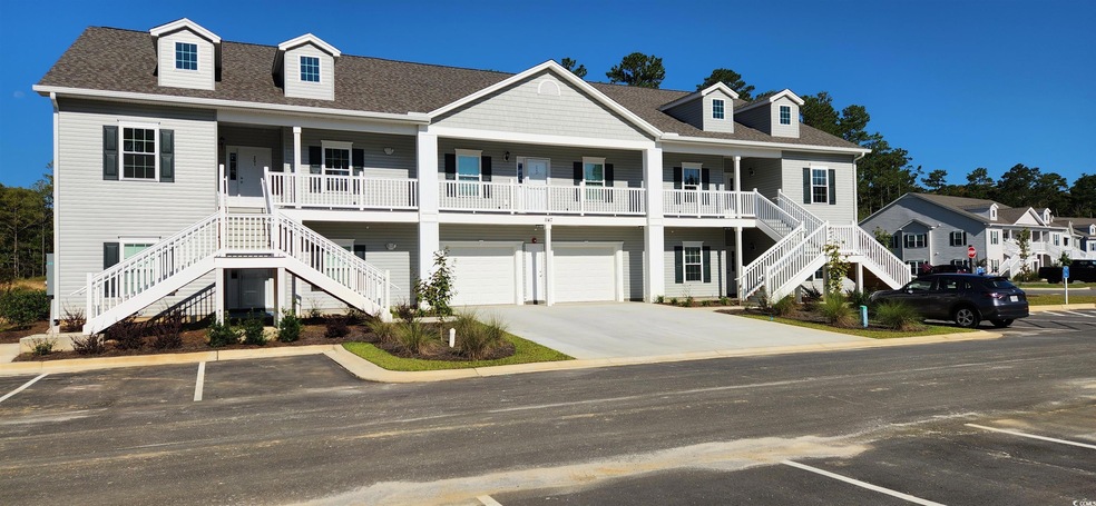 Beach home with a garage and covered porch