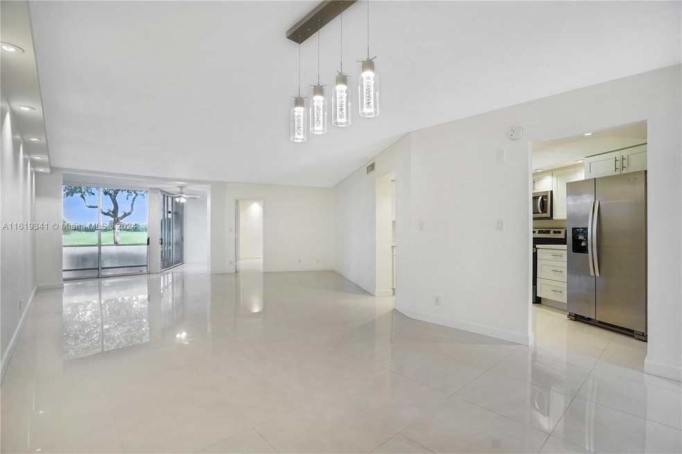LIVING DINING AREA WITH VIEW TO THE KITCHEN AND LAKE
