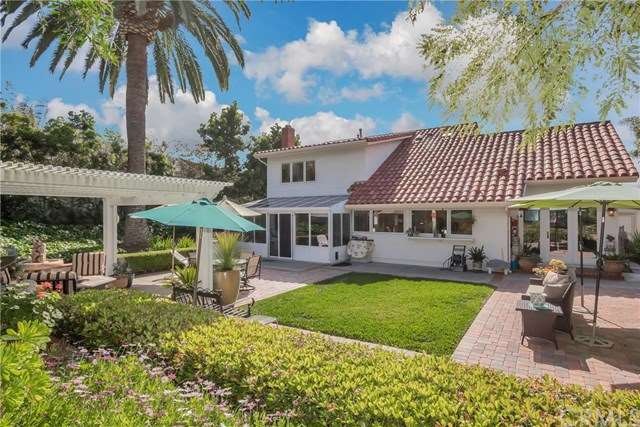 Tile roof, pavers, grassy area, all add to the bea