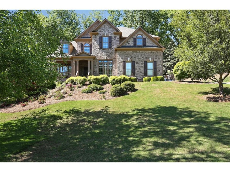 Great curb appeal in this beautiful brick-front ho