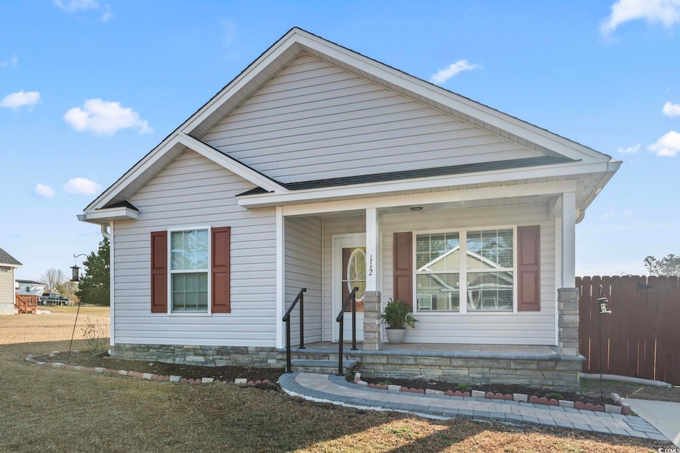View of front of house with covered porch