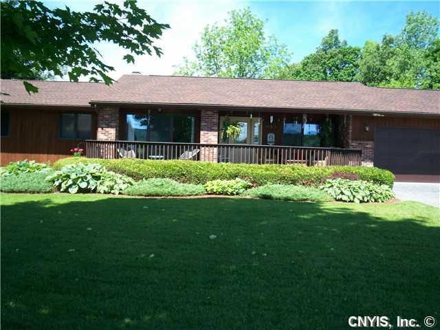 Exterior Front. Brick and cedar ranch has huge qua