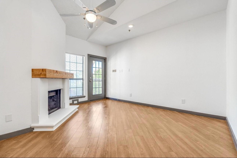 Unfurnished living room with ceiling fan, lofted c