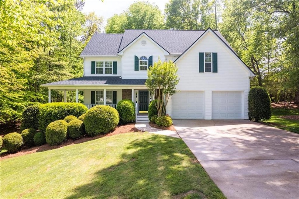 View of front of home featuring a garage, a front 