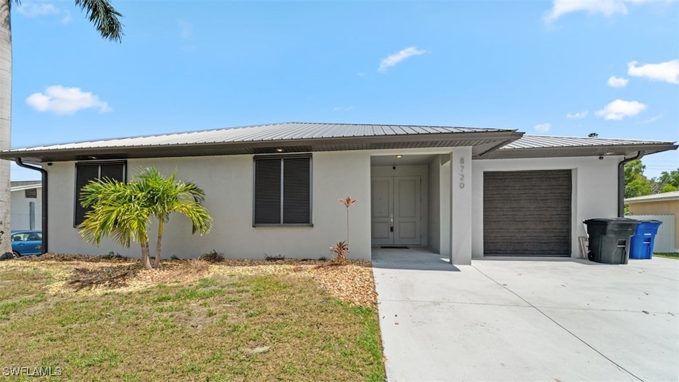 View of front facade featuring a garage