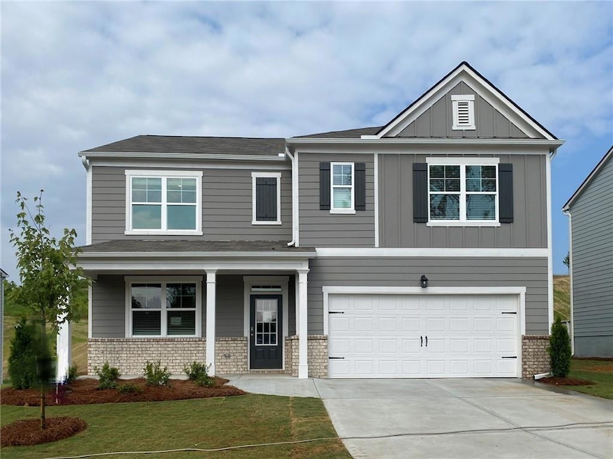 Craftsman inspired home with concrete driveway, bo