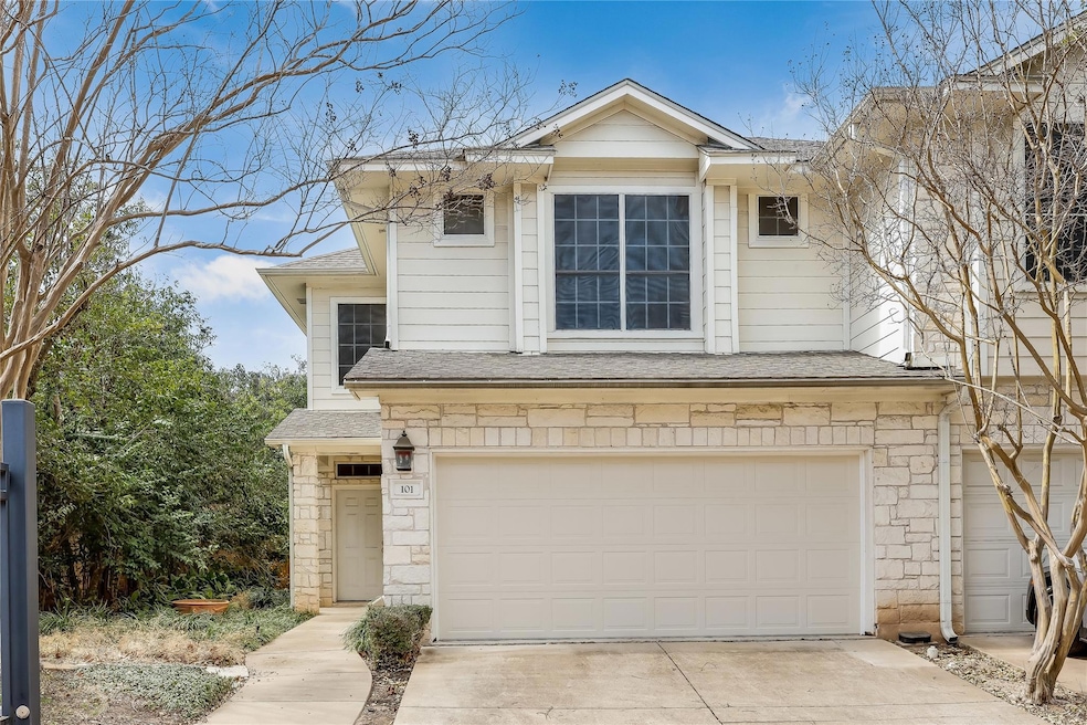 View of front of house featuring a shingled roof,