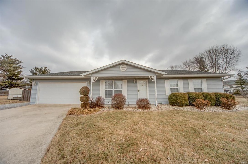 Covered front porch and attached 2 car garage