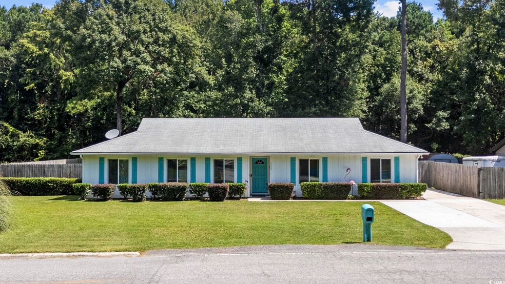 Ranch-style home featuring a front yard