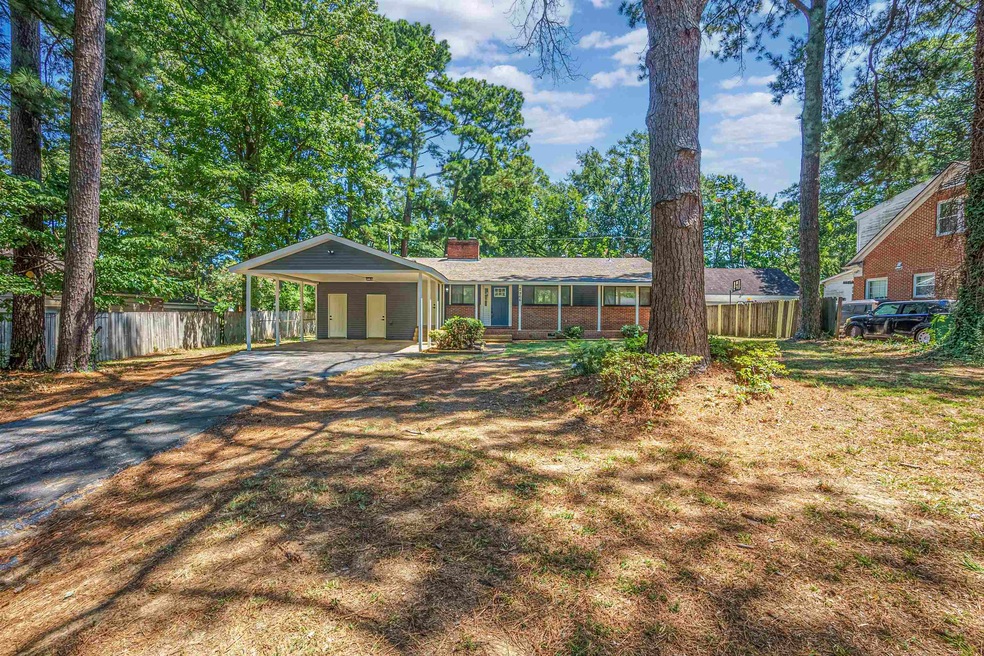 View of front of home featuring a carport