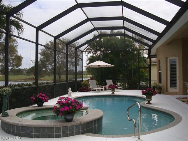 Long Pool/Spa shot with view of water and golf cou