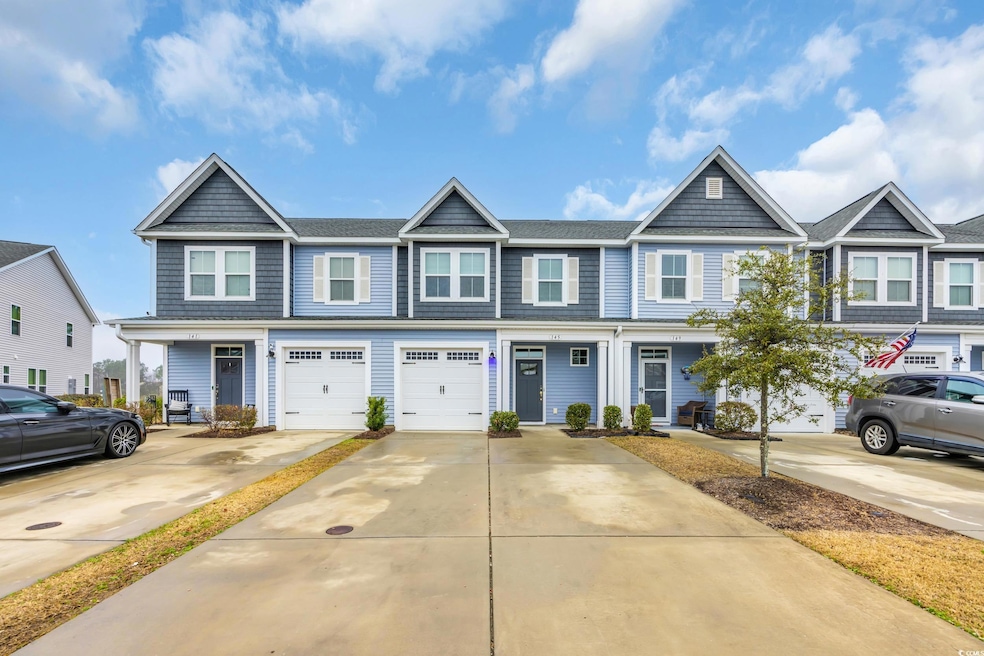 View of front of home featuring a garage