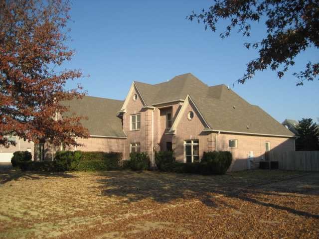 Beautifully landscaped yard with Two mature trees 