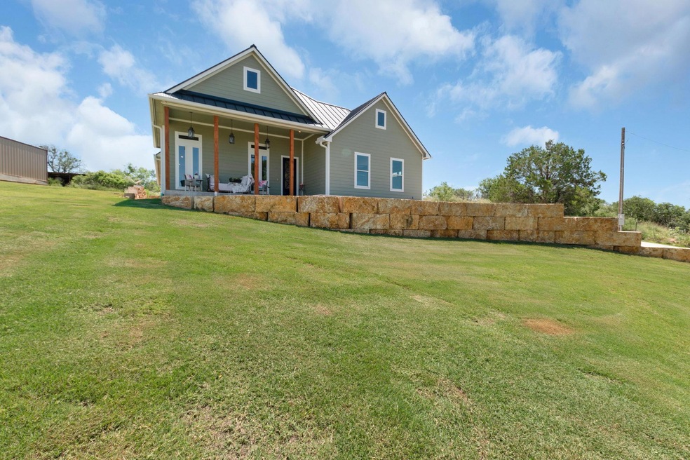 View of front of property with a standing seam ro