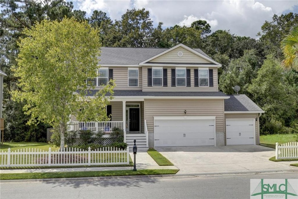 private wooded lot, 2 car garage PLUS golf cart ga