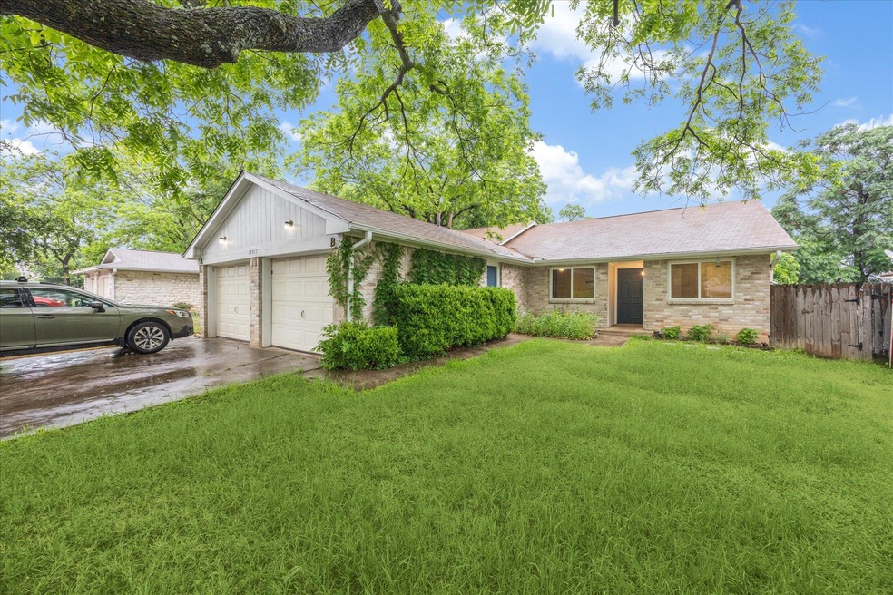Ranch-style home with brick siding, an attached g