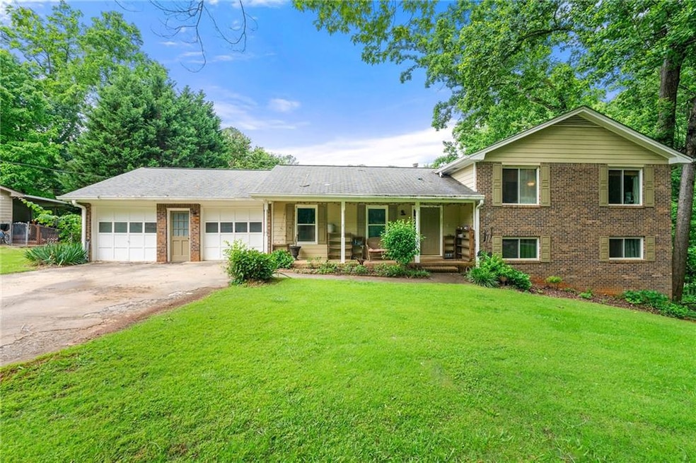 Split-level home with covered porch, brick siding