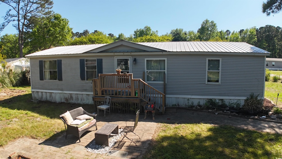 Manufactured / mobile home with a patio area, a fr