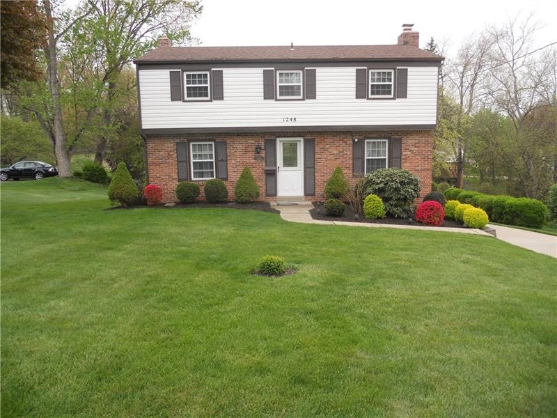 Wonderful curb appeal on this mostly brick home th