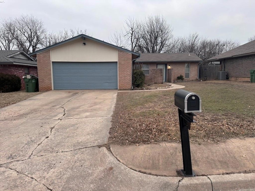 View of front of property with a garage, driveway,