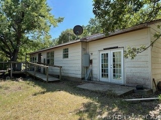 Front view of home, showing entry deck