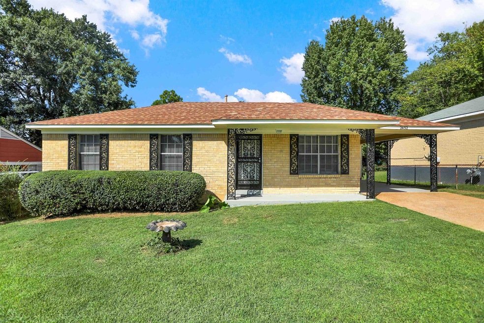 Single story home featuring a front lawn