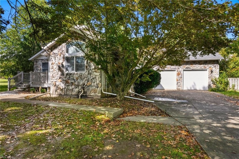 Obstructed view of property with a garage