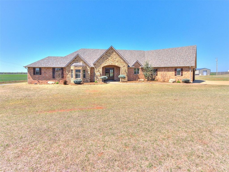 View of front of house featuring a front yard, bri