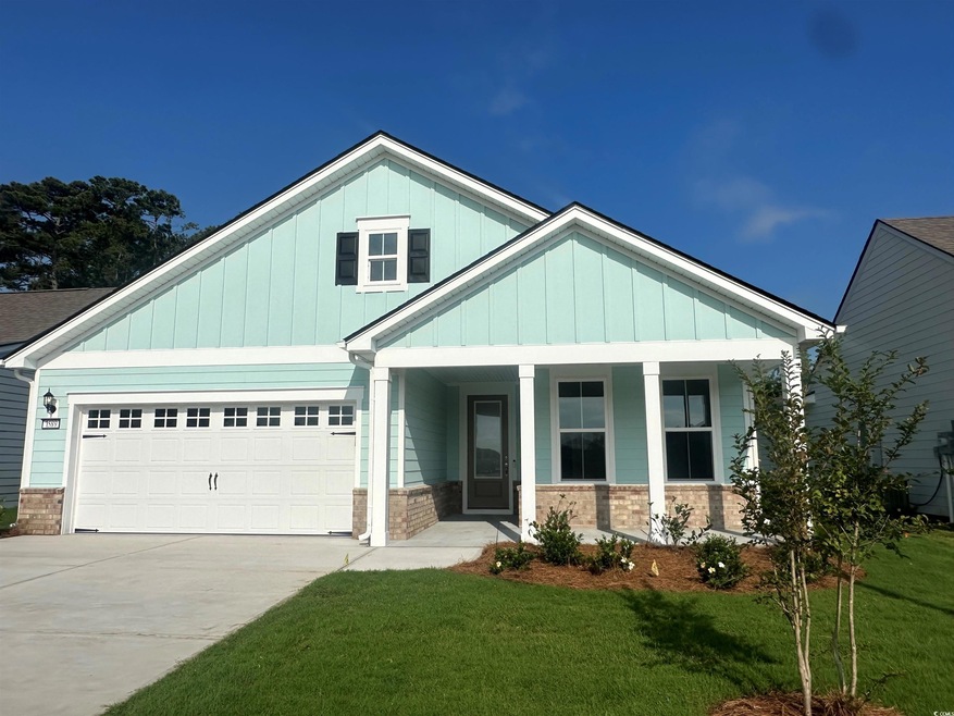 Craftsman-style house with covered porch, a garage