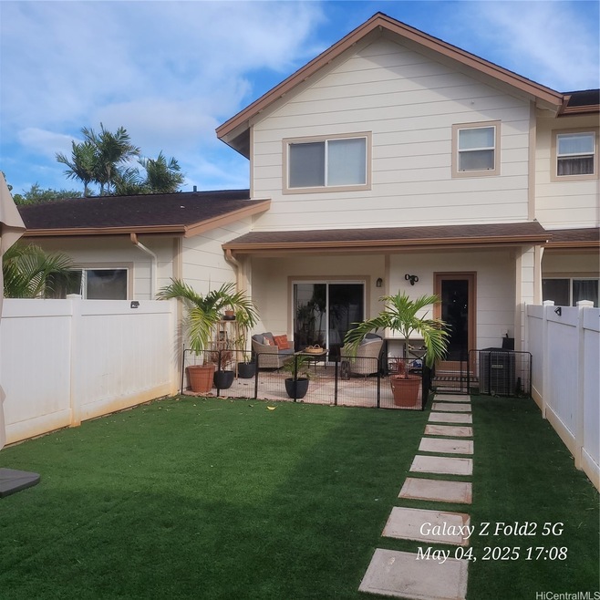 Low maintenance backyard in between the 2 car gara