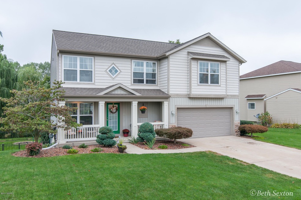 8341 Hawkshead SE unit 66, Byron Center, MI 49315 - photo 1