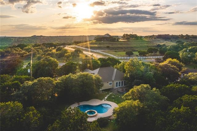 The pastoral landscape surrounding this stunning Dripping Springs home is breathtaking.
