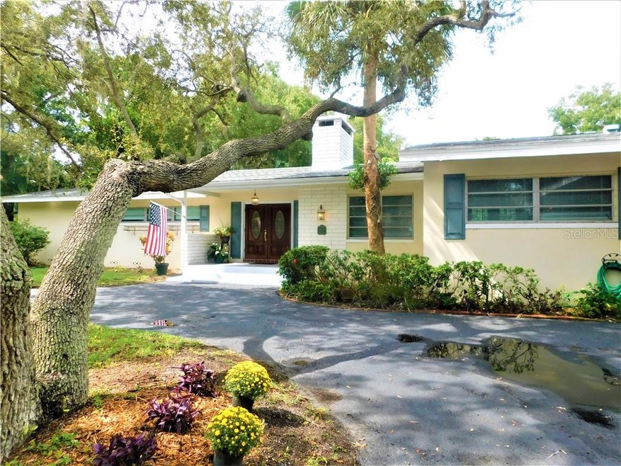 Circular drive leads to a welcoming entry porch.