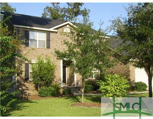 Exterior Front. PROFESSIONALLY LANDSCAPED LAWN.