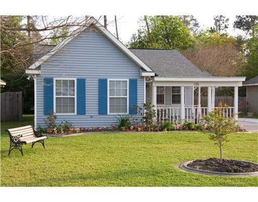 Photo. Nicely manicured lawn and gardens.  Home ha